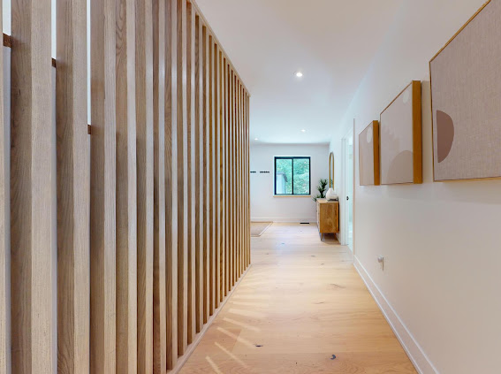 Oak slat partition along the hallway
